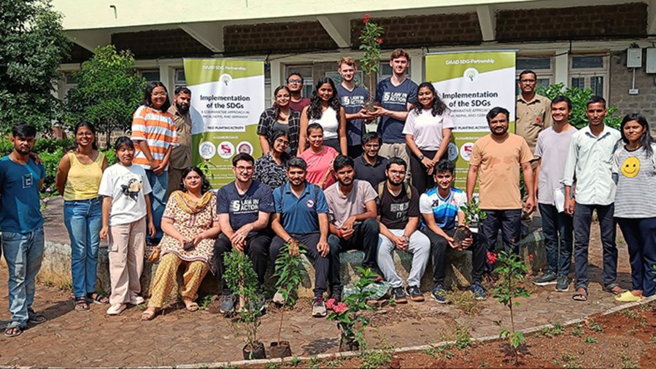 A group photograph featuring people who took part in the planting of a butterfly garden on the grounds of the Department of Ancient Indian History, Culture and Archaeology at the Deccan College Post-Graduate &amp; Research Institute (Deemed University).